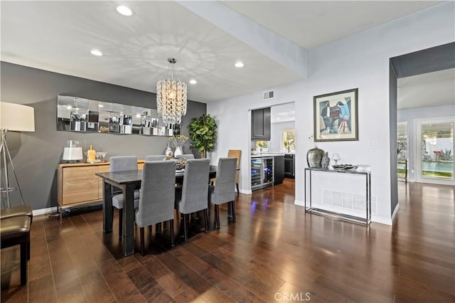 dining room featuring beverage cooler, recessed lighting, dark wood-style floors, and visible vents