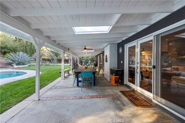 view of patio / terrace featuring outdoor dining area and a ceiling fan