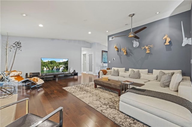 living area featuring visible vents, a ceiling fan, recessed lighting, wood-type flooring, and an accent wall