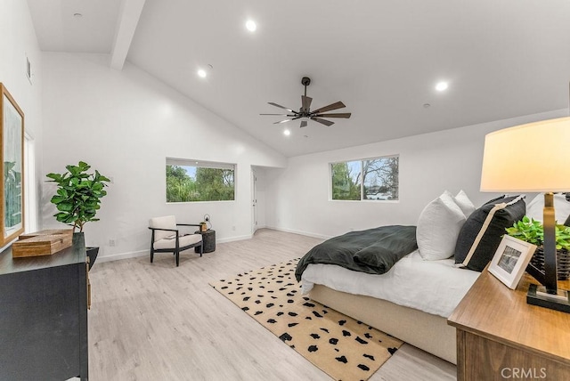 bedroom featuring multiple windows, high vaulted ceiling, beam ceiling, and light wood finished floors