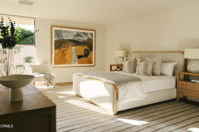 bedroom featuring visible vents