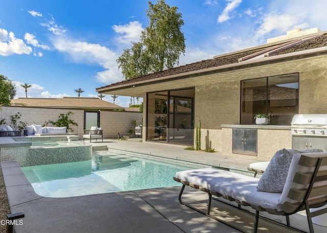 view of swimming pool featuring an in ground hot tub, area for grilling, a patio area, and a fenced in pool