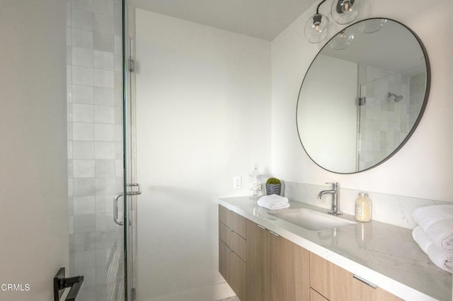 bathroom with vanity and a stall shower