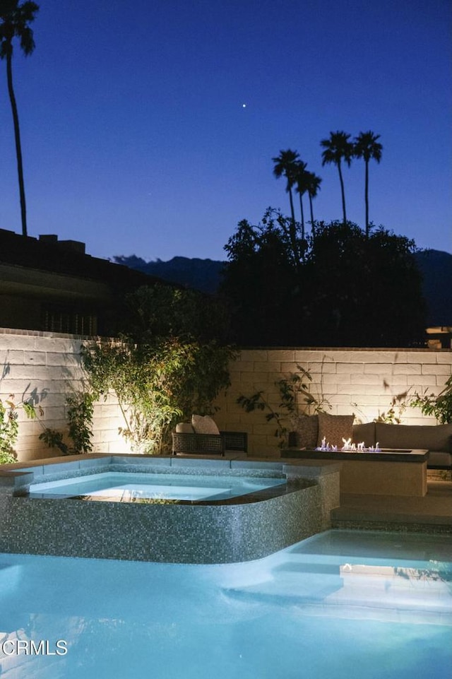 35 Lafayette Dr, Rancho Mirage, CA 92270 - view of swimming pool with a hot tub and fence
