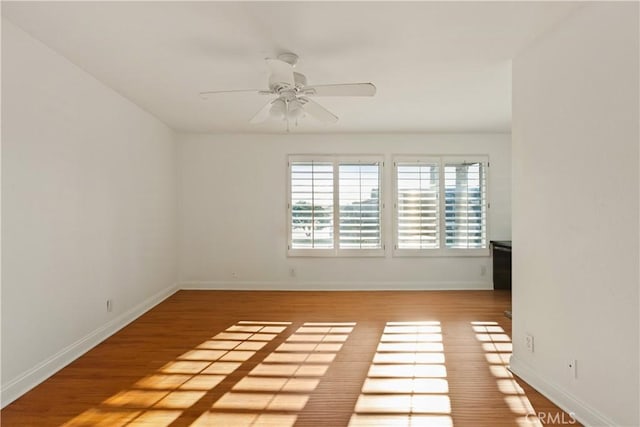 16061 Surprise Ln, Huntington Beach, CA 92649 - spare room featuring baseboards, ceiling fan, and wood finished floors