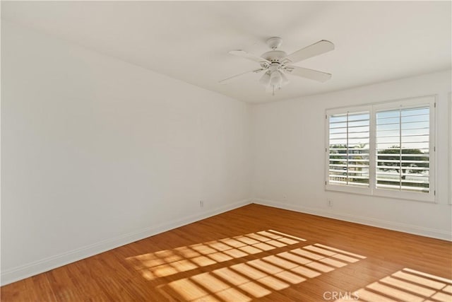 16061 Surprise Ln, Huntington Beach, CA 92649 - empty room featuring ceiling fan, baseboards, and wood finished floors