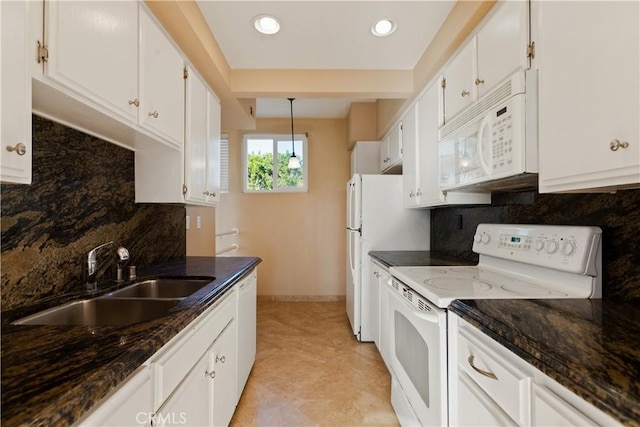 16061 Surprise Ln, Huntington Beach, CA 92649 - kitchen with white cabinets, white appliances, dark stone counters, and a sink