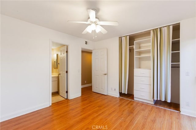 16061 Surprise Ln, Huntington Beach, CA 92649 - unfurnished bedroom with visible vents, light wood-type flooring, and baseboards