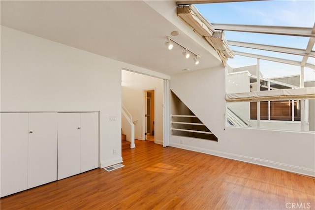16061 Surprise Ln, Huntington Beach, CA 92649 - interior space with stairway, wood finished floors, visible vents, and baseboards