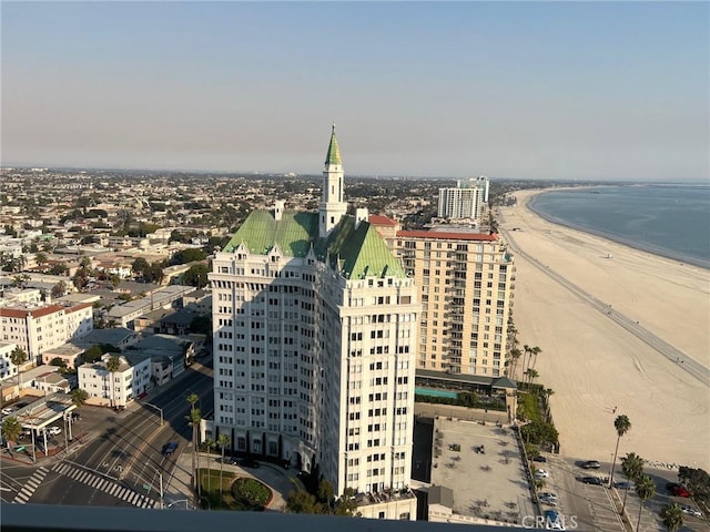 birds eye view of property featuring a water view, a city view, and a view of the beach