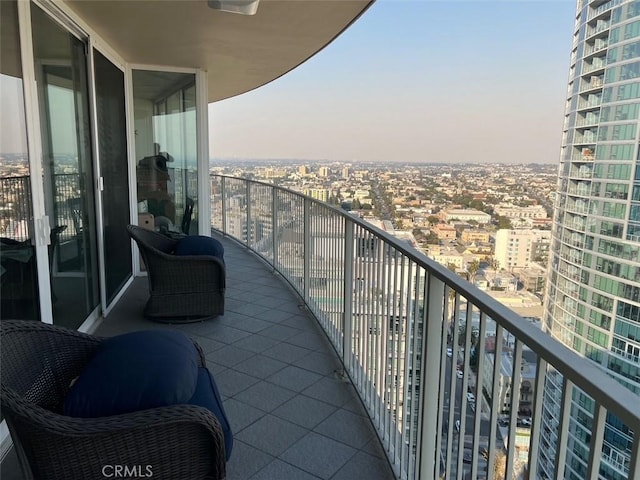 balcony featuring a view of city