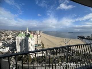 balcony featuring a view of city and a water view