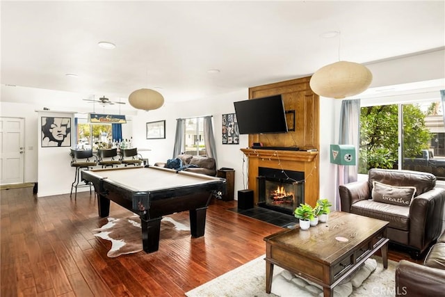 playroom with dark wood-style floors, plenty of natural light, a fireplace, and pool table