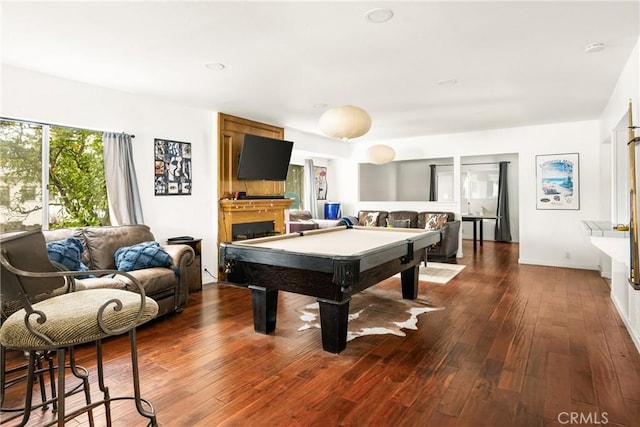 game room featuring a fireplace, pool table, and dark wood-style flooring