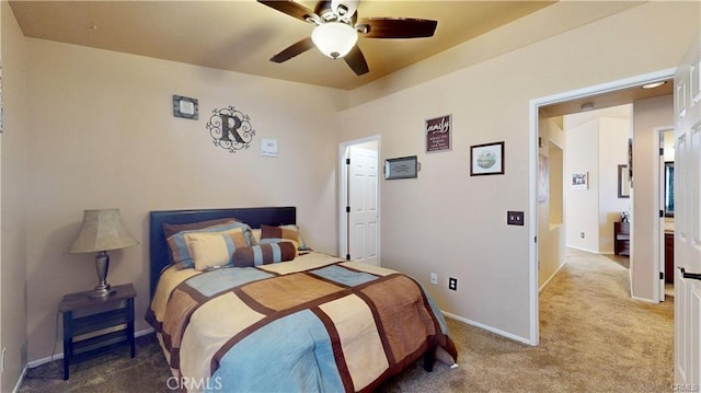 bedroom with baseboards, carpet, and a ceiling fan