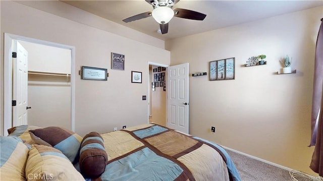 bedroom featuring baseboards, carpet, a closet, and ceiling fan