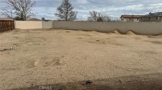 view of yard with a fenced backyard