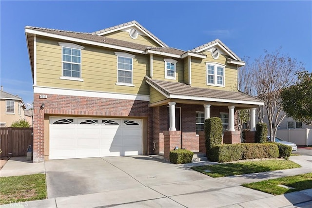 craftsman-style home with brick siding, fence, a porch, concrete driveway, and an attached garage