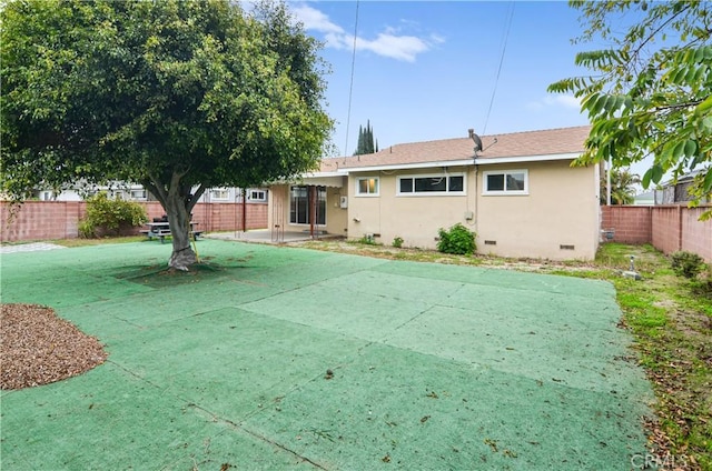 single story home featuring a shingled roof, stucco siding, a fenced backyard, and crawl space