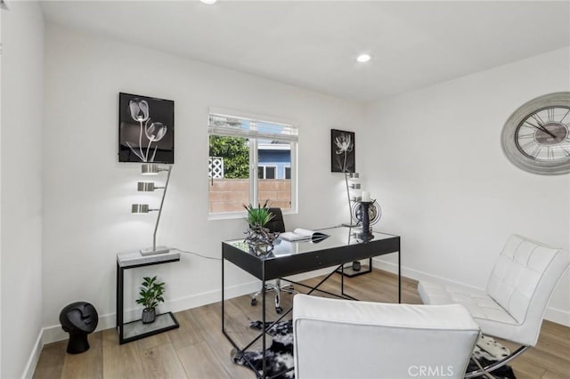 office area with recessed lighting, baseboards, and light wood-style floors