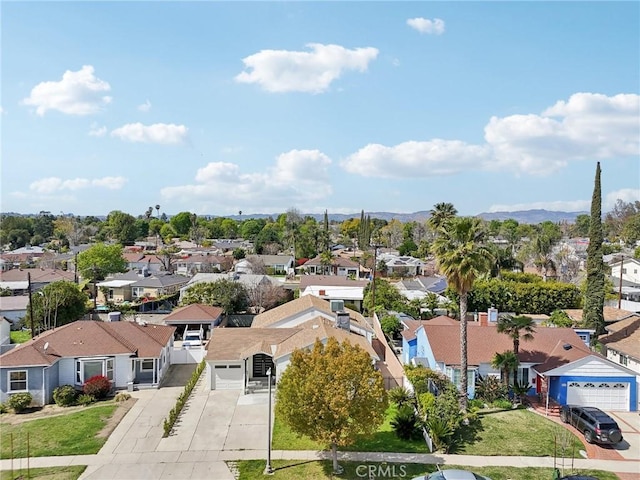 birds eye view of property with a residential view