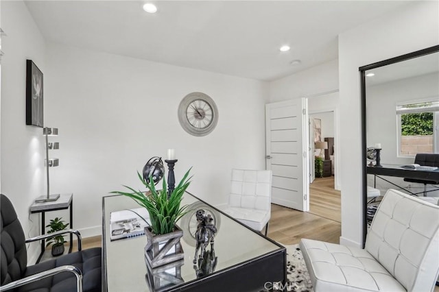 office featuring recessed lighting, wood finished floors, and baseboards