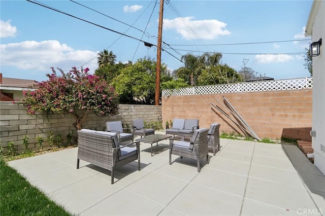 view of patio with a fenced backyard and an outdoor hangout area