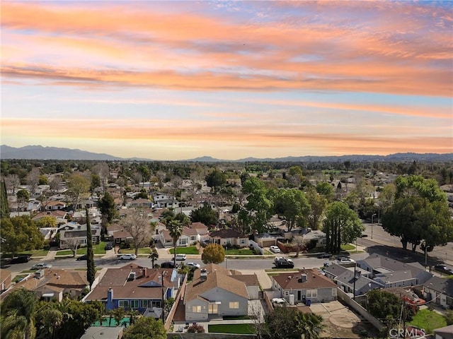 drone / aerial view with a residential view and a mountain view