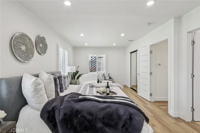 bedroom with visible vents, recessed lighting, light wood-style floors, and baseboards