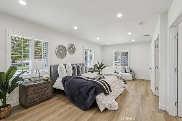 bedroom with visible vents, multiple windows, recessed lighting, and light wood-type flooring