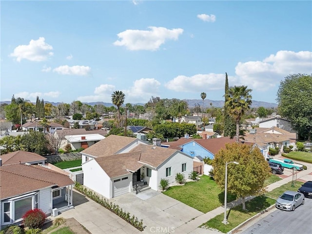 birds eye view of property featuring a residential view and a mountain view