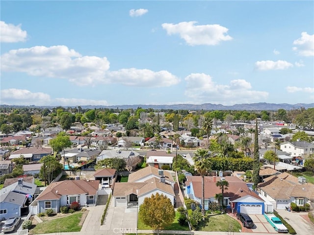 birds eye view of property featuring a mountain view and a residential view