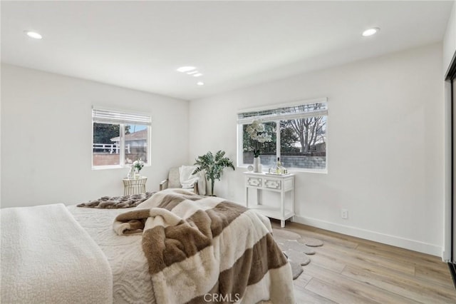 bedroom featuring recessed lighting, baseboards, and light wood finished floors