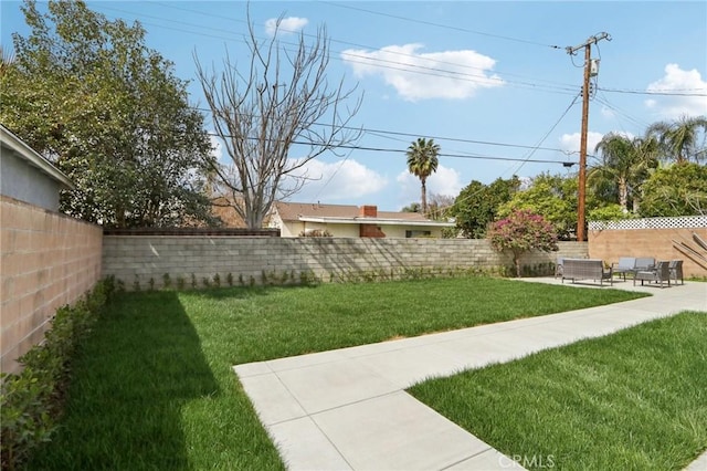 view of yard featuring a patio area and a fenced backyard