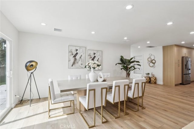 dining space with visible vents, recessed lighting, and light wood-type flooring