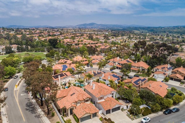 drone / aerial view with a residential view and a mountain view