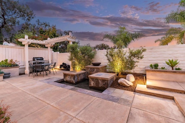 view of patio / terrace with outdoor dining area, a fenced backyard, and a pergola