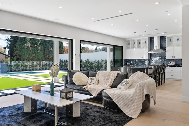 living room featuring recessed lighting and light wood-type flooring