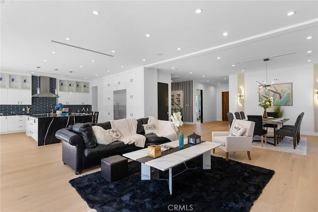 living room featuring recessed lighting and light wood-style floors