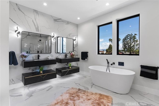 full bath with stone wall, a healthy amount of sunlight, and marble finish floor