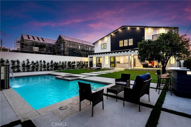 5012 Enfield Ave, Encino, CA 91316 - pool at dusk featuring a pergola, a fenced backyard, and a patio