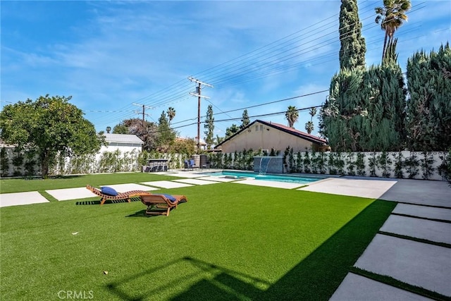 view of yard featuring a fenced in pool, a patio, and fence