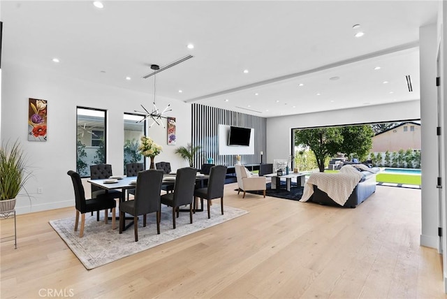 5012 Enfield Ave, Encino, CA 91316 - dining area featuring light wood finished floors, recessed lighting, and a chandelier