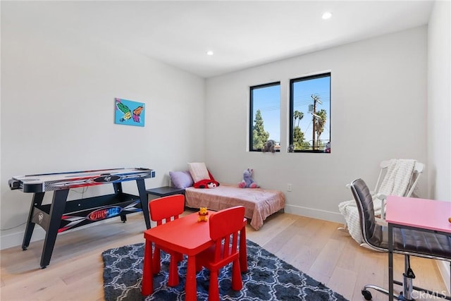 bedroom featuring recessed lighting, baseboards, and wood finished floors