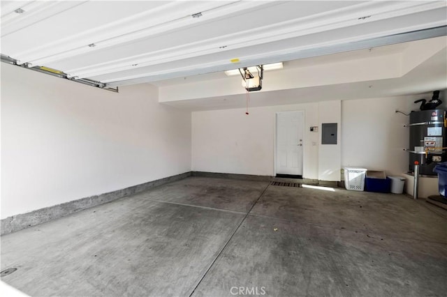 garage featuring strapped water heater, electric panel, a garage door opener, and baseboards