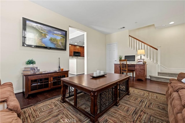 living area featuring recessed lighting, visible vents, wood finished floors, and stairs