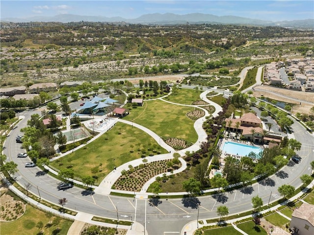 birds eye view of property with a mountain view