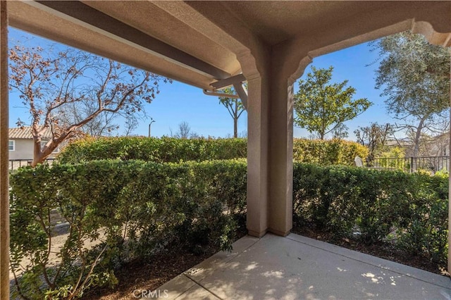 view of patio / terrace featuring fence