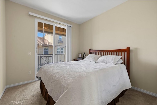 carpeted bedroom with baseboards