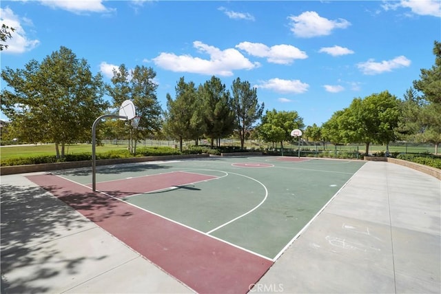 view of basketball court featuring community basketball court and fence